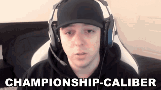a man wearing headphones and a hat says " championship-caliber "