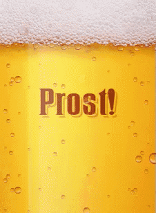 a close up of a glass of beer with the word prost on it