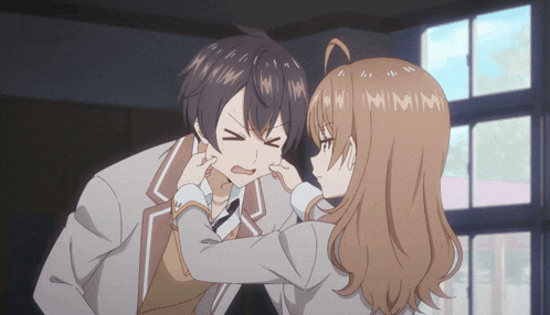 a boy and a girl are fighting with the girl making a face