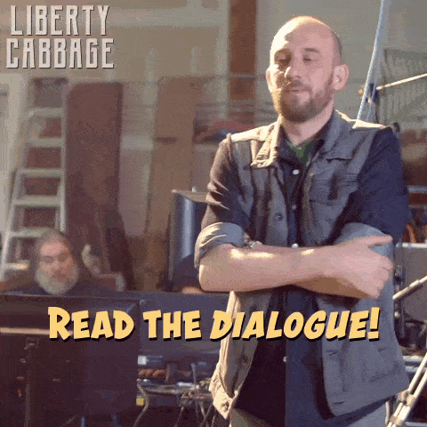a man stands with his arms crossed and reads the dialogue