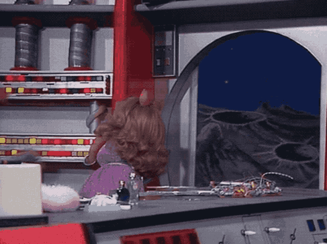 a doll in a purple dress stands in front of a window with a view of the moon