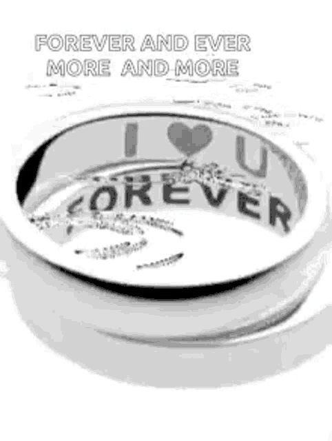a silver ring with the words `` forever and ever more and more '' written on it