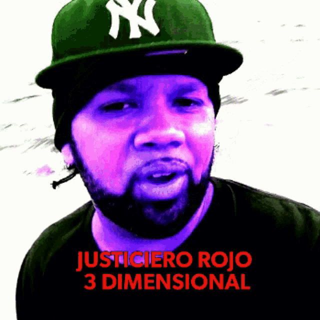 a man with a beard wearing a green ny hat and a black shirt that says justiciero rojo 3 dimensional
