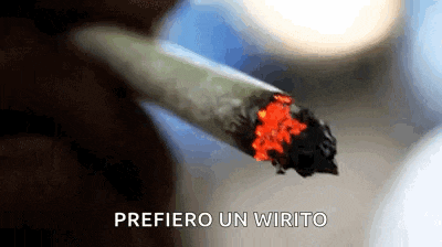 a close up of a person smoking a cigarette with the words prefero un wirito in the corner .