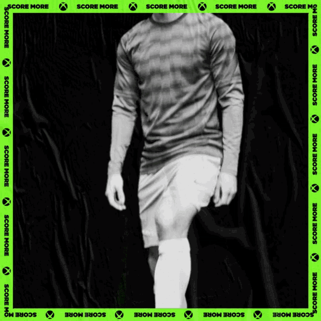 a black and white photo of a soccer player with score more written on the bottom