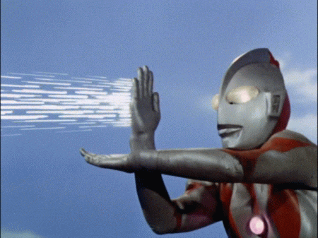 a man in a superhero costume is holding up his hands in the air