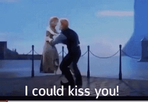 a video of a man and woman dancing with the words i could kiss you