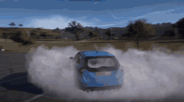 a blue car with a license plate that says n17 is driving down a road