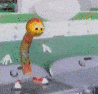 a slinky toy is standing on a sink with a balloon in the background .