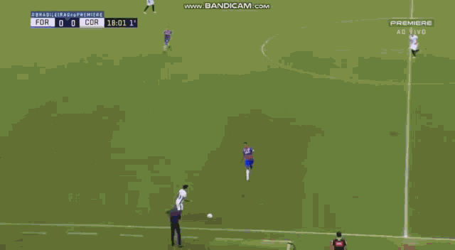 a group of soccer players are celebrating a goal in front of an empty stadium