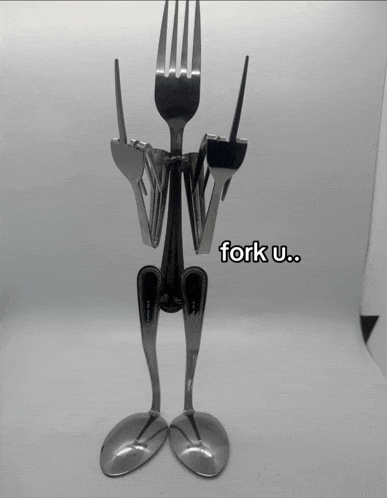 a statue made out of forks and spoons that says fork u..