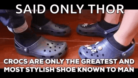 a couple of people wearing crocs are standing next to each other .