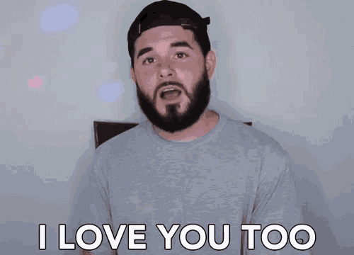 a man with a beard wearing a hat says i love you too