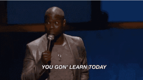 a man in a suit and tie is holding a microphone and saying " you gon ' learn today "