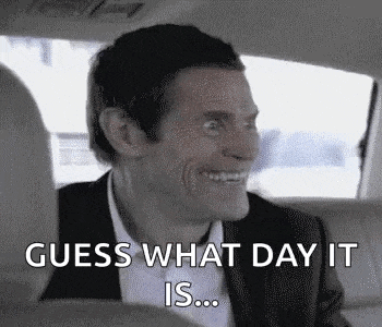 a man in a suit is sitting in the back seat of a car .