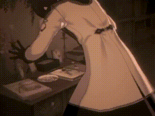 a person in a white coat standing in front of a table