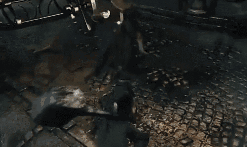 a person is standing in a dark room with smoke coming out of the ceiling .