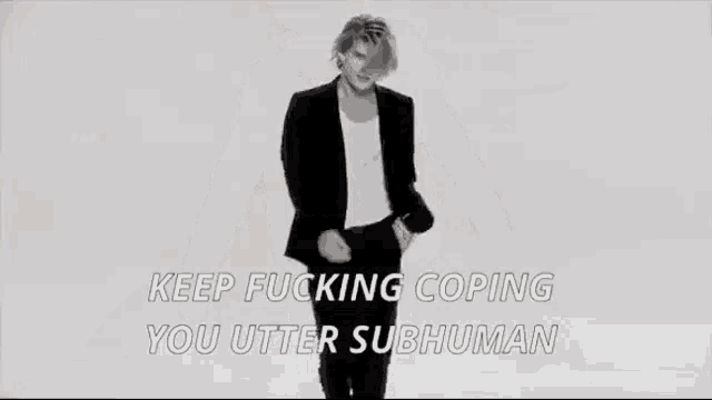 a black and white photo of a man with the words keep fucking coping you utter subhuman