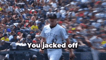 a baseball player with the number 47 on his jersey is walking in front of a crowd and says you jacked off