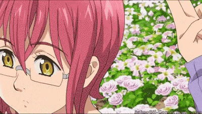 a girl with pink hair and glasses is standing in front of a field of pink flowers .