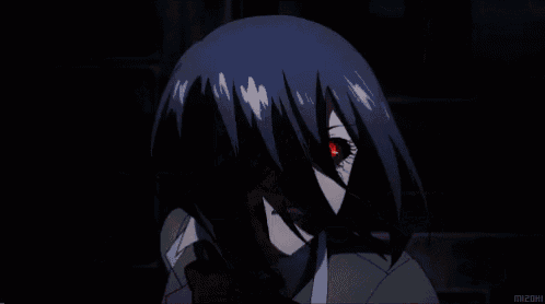 a close up of a person 's face with red eyes .