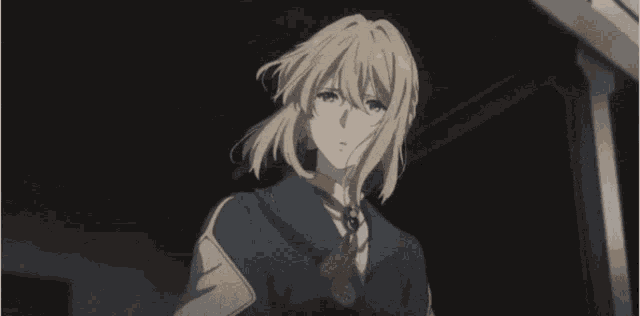 a girl with blonde hair is wearing a blue jacket and a tie .