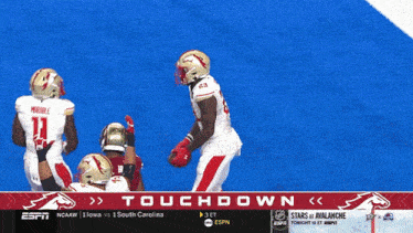 espn is showing a football game between lowa and south carolina