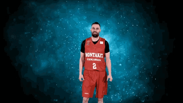 a man is wearing a red jersey that says montakit