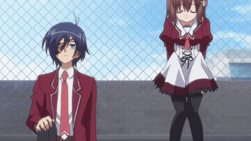 a boy and a girl standing next to each other