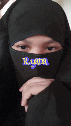a woman wearing a black hijab with the name ryana on it