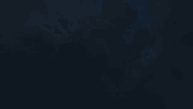 a blue light is coming out of a hole in the ground .