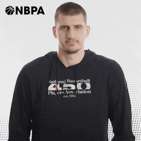 a man wearing a hoodie that says national basketball 450 on it