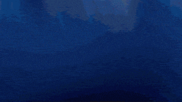a dark blue background with a few stars on it