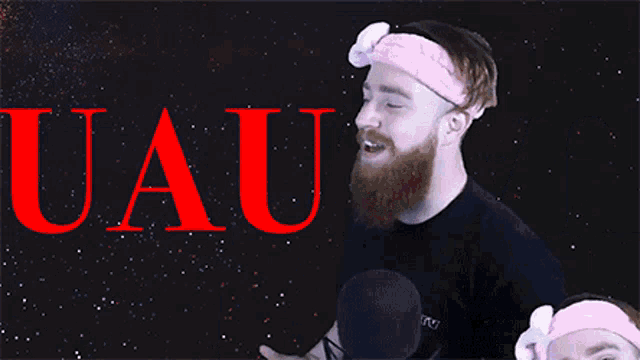 a man with a beard wearing a pink headband with the word uaivo on the background