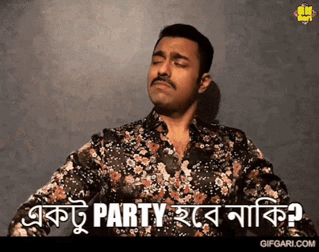 a man with a mustache is wearing a floral shirt and says " party " in a foreign language