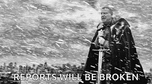 a man in a fur coat is holding a sword in the snow .