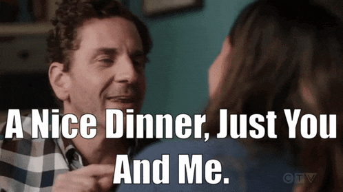a man and a woman are having a nice dinner
