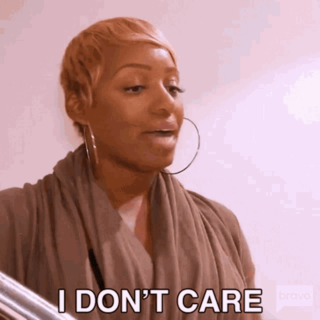 a woman wearing hoop earrings and a scarf is saying i don t care .