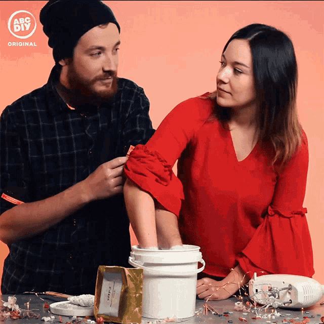 a man and a woman are standing next to each other with the abc diy logo on the bottom