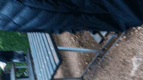 a blurred image of a person standing on a staircase