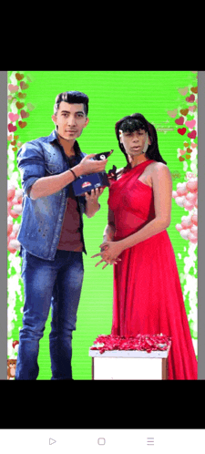 a man and a woman standing next to each other on a green background