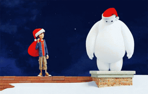 a boy wearing a santa hat is standing next to a large white snowman