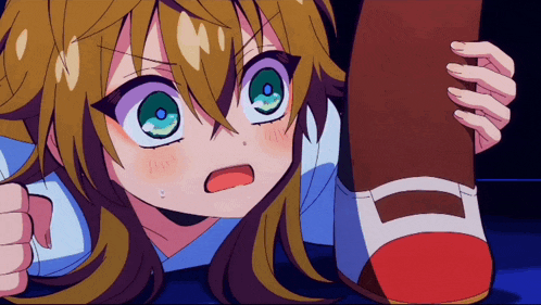 a girl with green eyes is holding a shoe in her hand