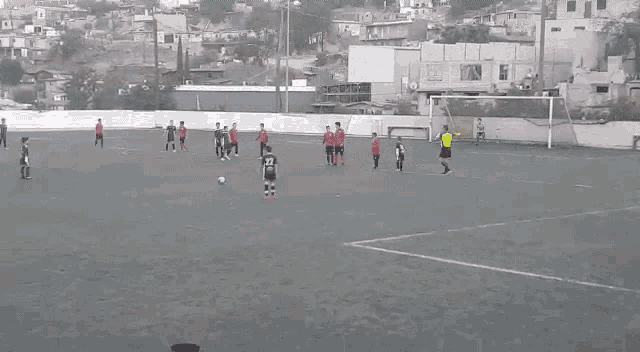 a group of people are playing soccer on a field . one of the players has the number 22 on his shirt .