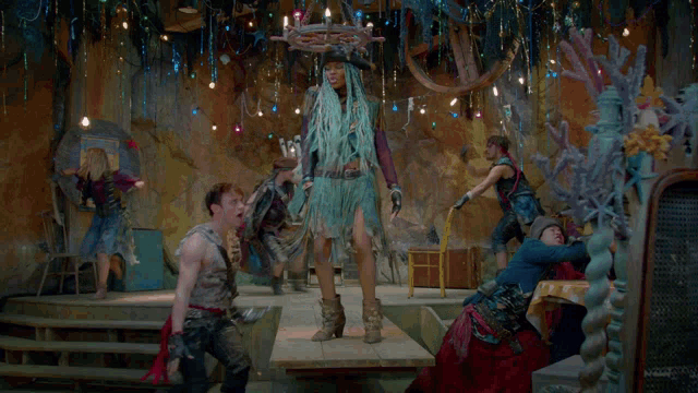 a man in a pirate costume is standing next to a woman with long hair