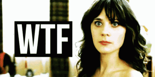 a woman is standing in front of a wtf sign