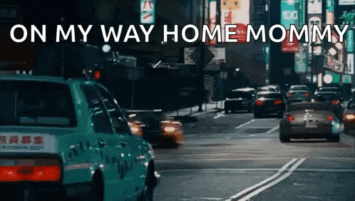 a taxi is driving down a busy city street with the words on my way home mommy written on the bottom