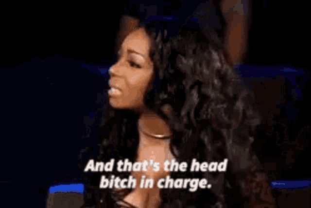 a woman is saying `` and that 's the head bitch in charge '' while sitting in a chair .