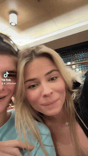 a woman 's face is shown in a tiktok video taken by @kittychen