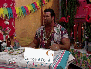 a man sitting at a table holding a sign that says crescent point